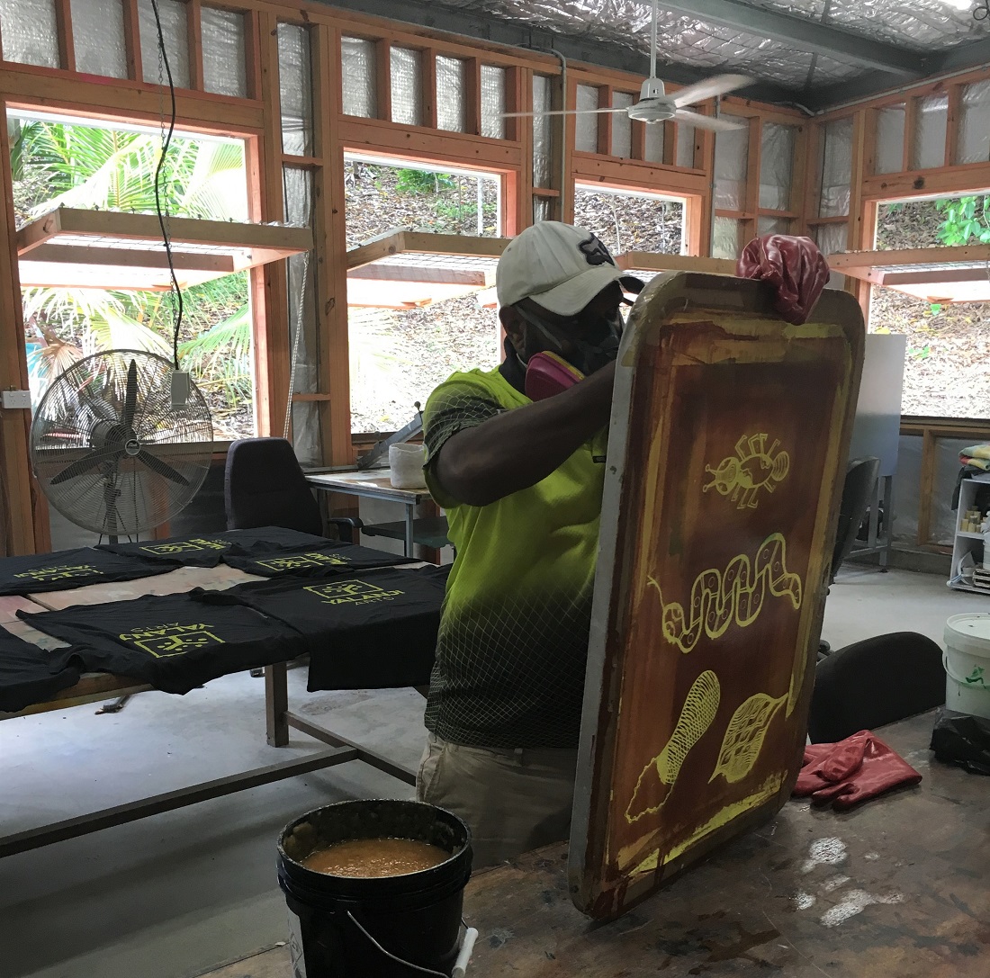 Setting up the registration for printing carry bags with the Yalanji Arts logo, Black Square Arts screen printing workshop, Image Yalanji Arts ©